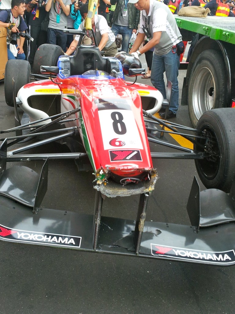 raffaele-marciellos-damaged-f3-car-is-lowered-from-the-back-of-truck-after-being-lifted-off-the-track