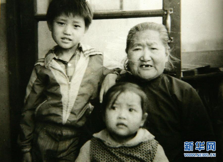 Li Na, aged 2, with her great-grandmother and her uncle (apparently)